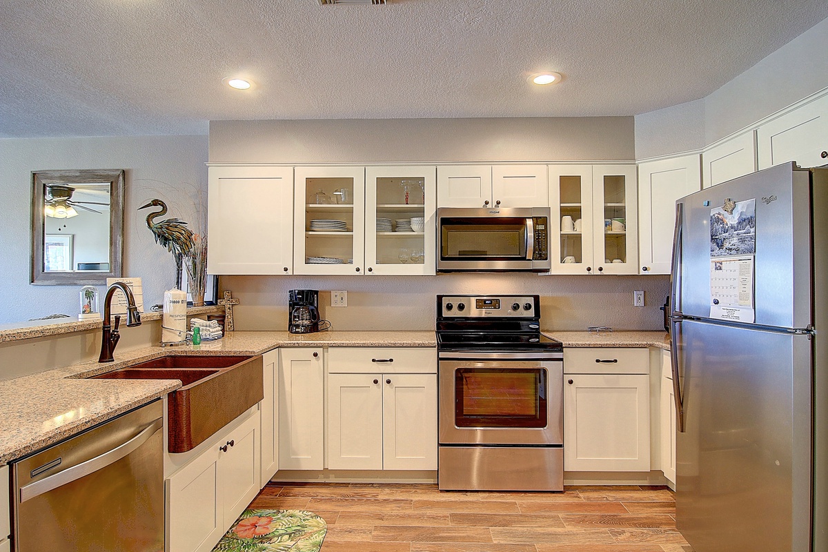 Cook memorable meals in your bright, fully-equipped kitchen featuring granite counters, stainless appliances, and everything you need for a perfect stay.