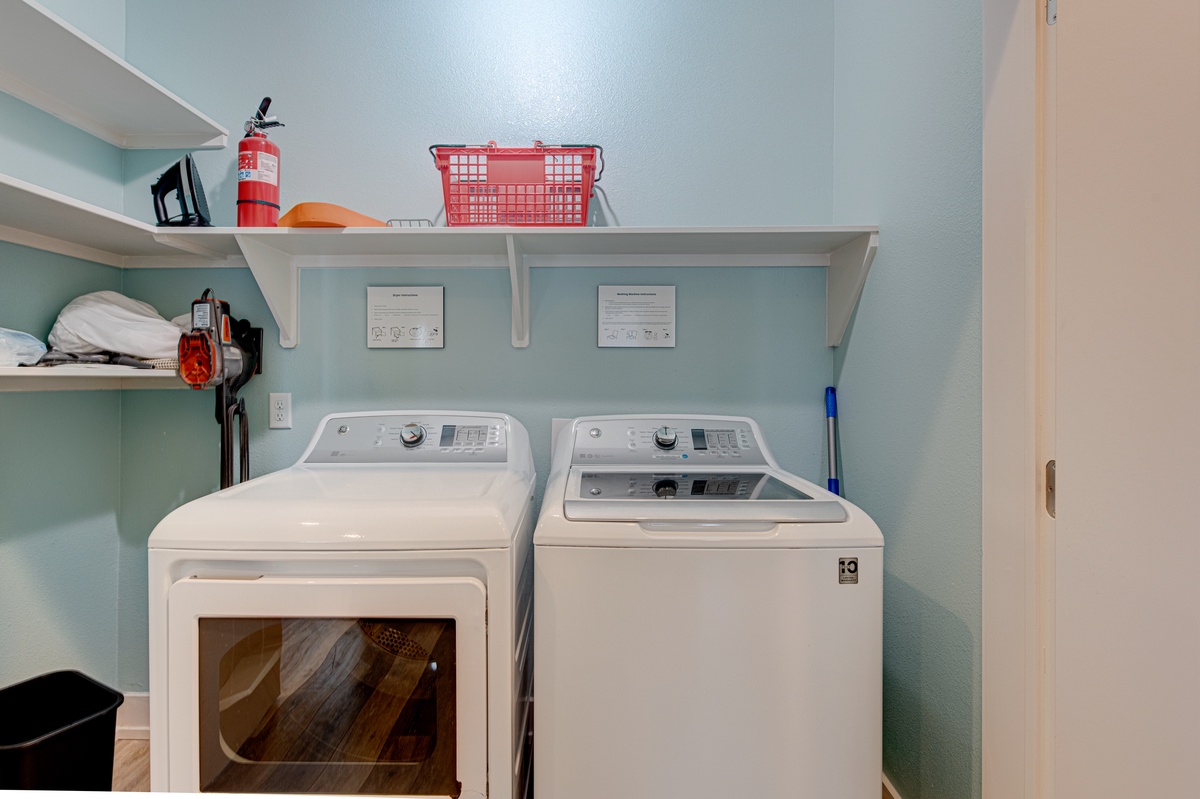 Keep your clothes fresh in your dedicated laundry room with full-size washer and dryer plus storage shelving.