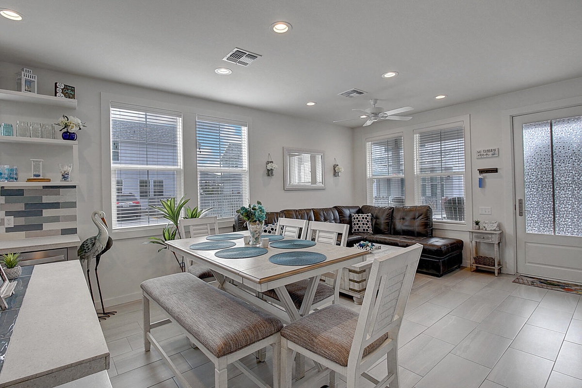 Your open-concept space flows seamlessly from dining to living, with coastal touches and abundant natural light creating a welcoming retreat.