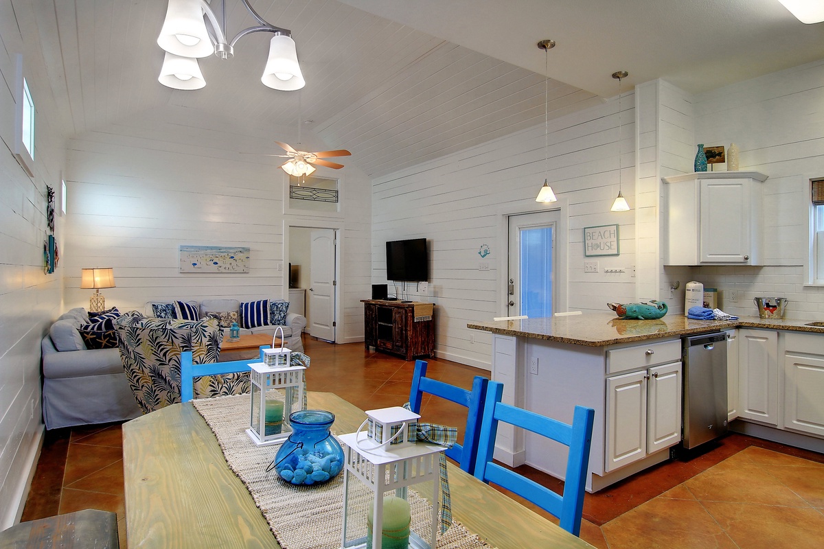 Relax in your bright coastal retreat where the open-concept design flows from kitchen to living space, complete with beach-themed décor and modern amenities.