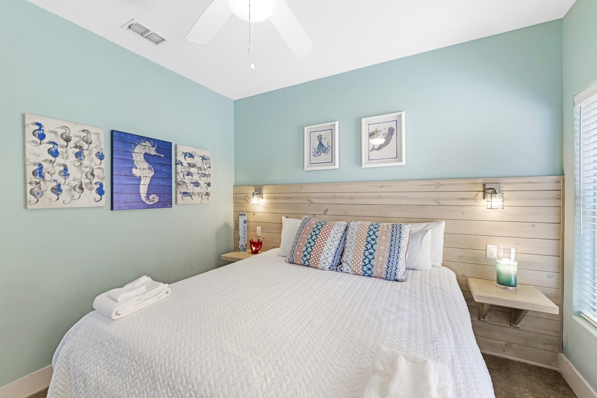 Coastal colors and charming sea-inspired décor create a welcoming retreat for a restful night’s sleep.