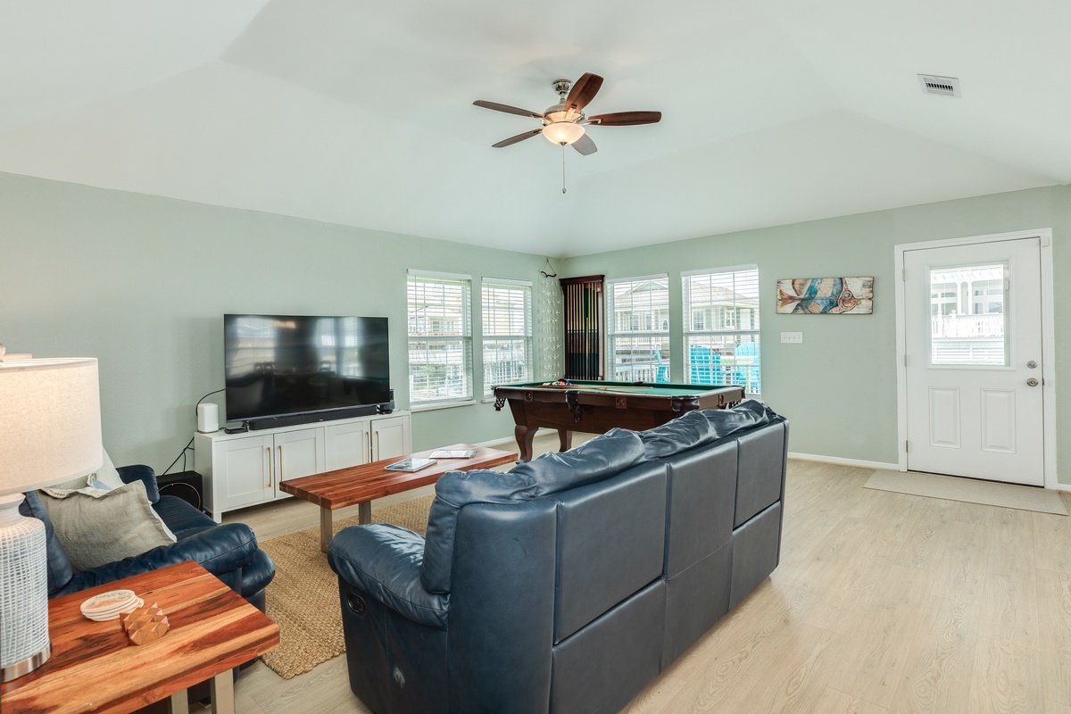 Comfortable seating, pool table, tv and great views in the living area