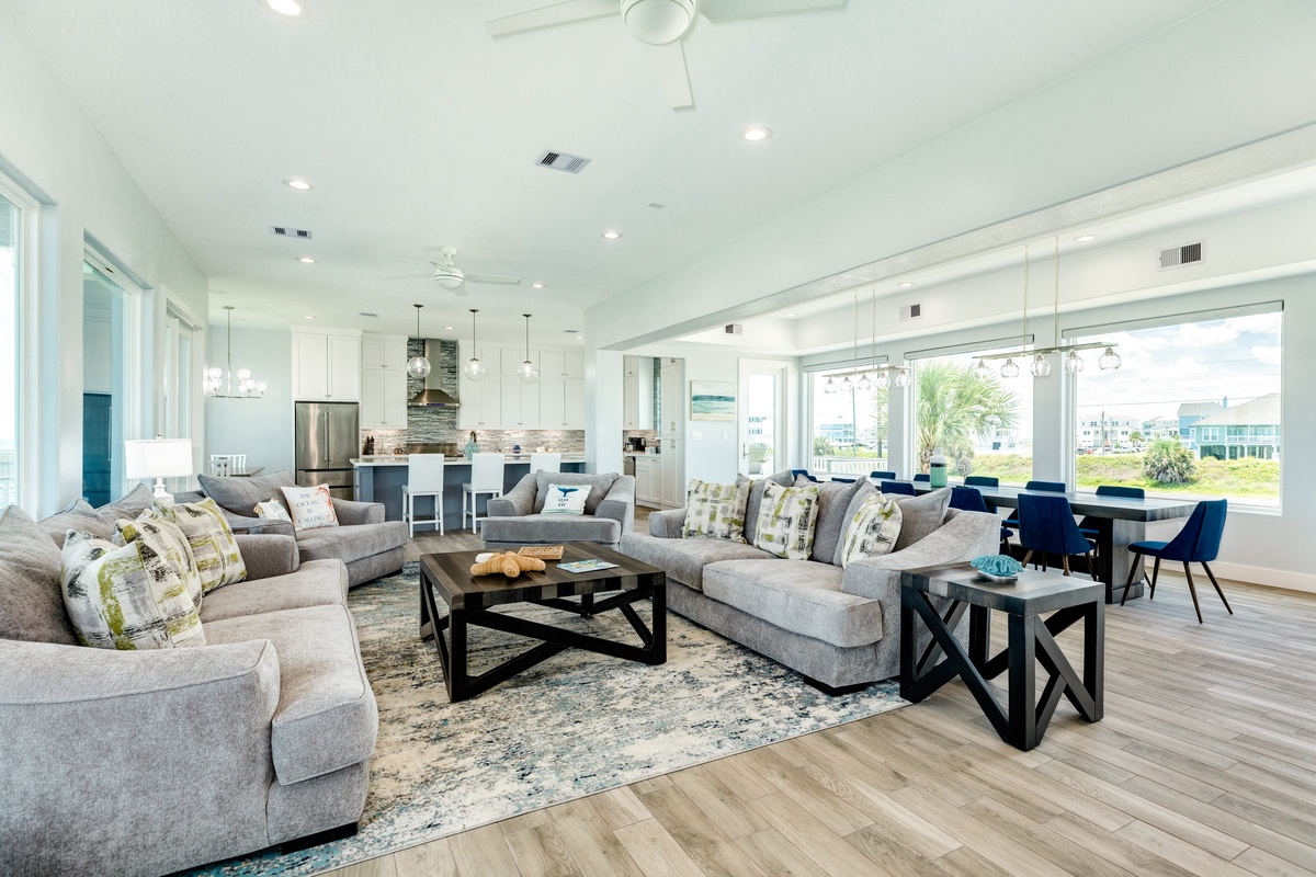 Bright and airy main level living area thanks to the wall of windows on either side