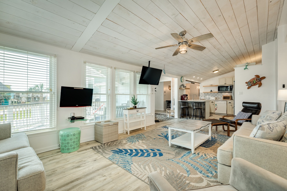 Bright and airy living area with wall of windows