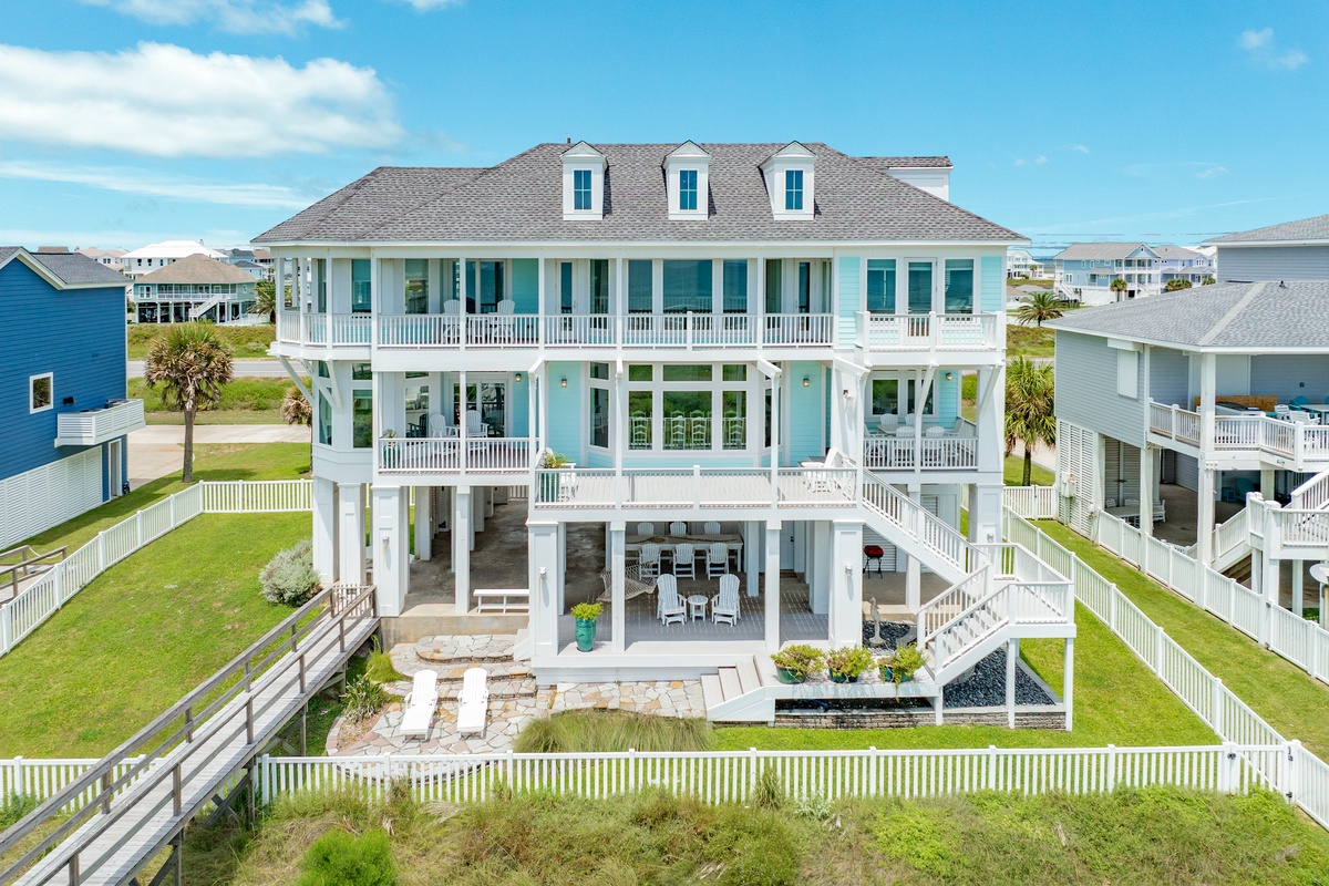 Fenced-in yard, private dune walkover, and so much deck space - you'll love The White Crane!