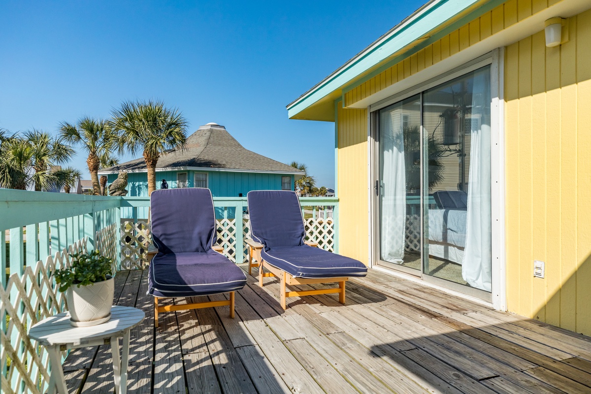 Soak up the sun on the partially covered deck of this beachside gem