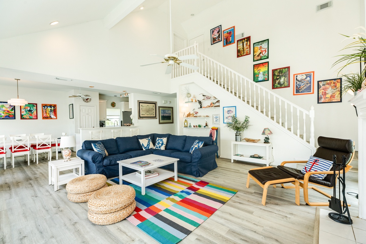 Open living area with comfortable seating and wall of windows