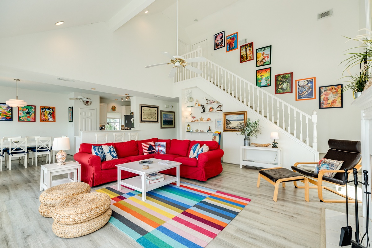Open living area with comfortable seating and wall of windows