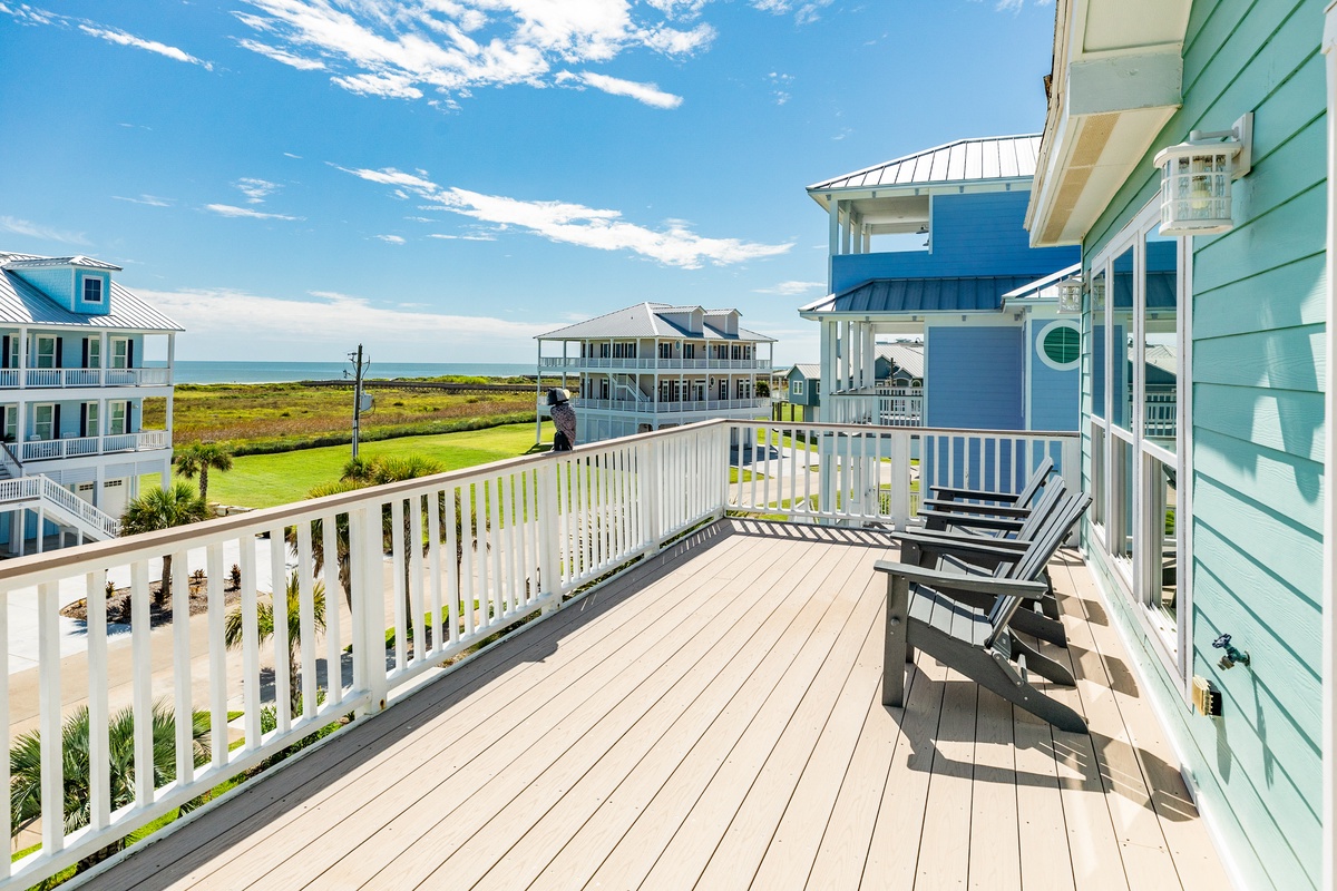 Expansive uncovered deck with peek-a-boo views of the Gulf