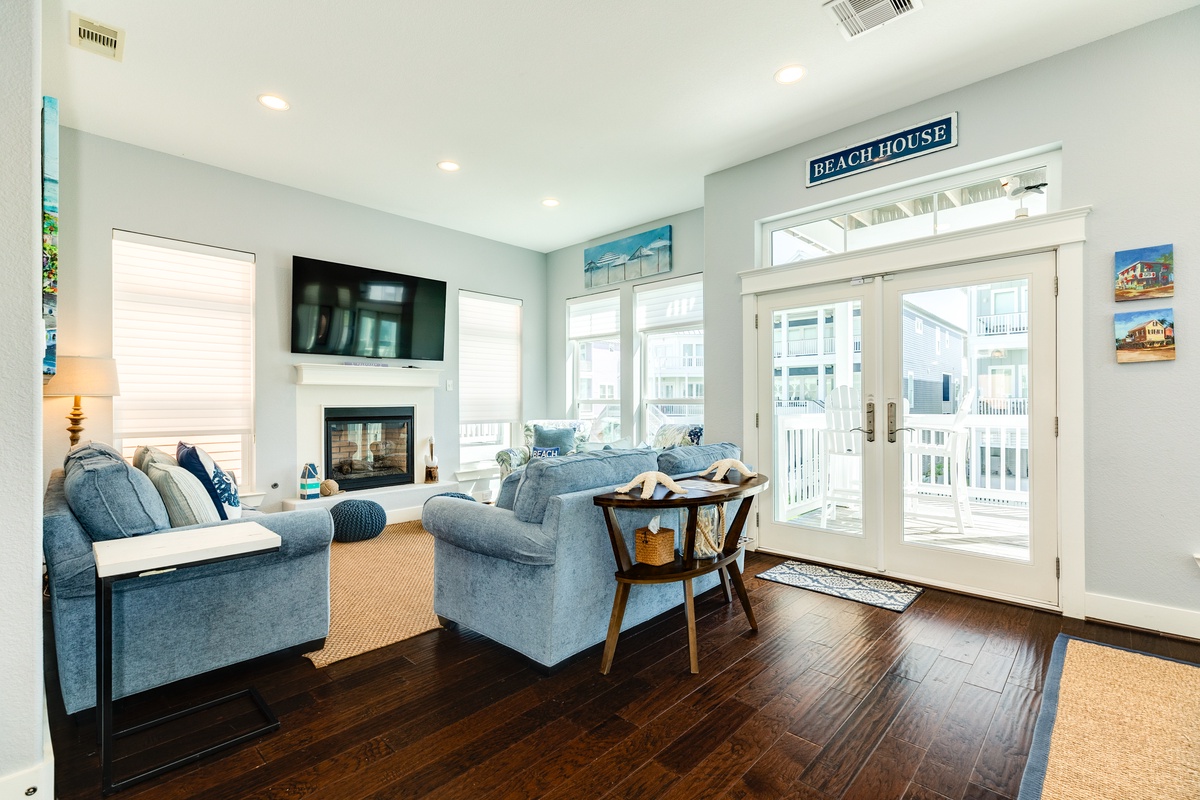 Bright and airy living area with walls of windows