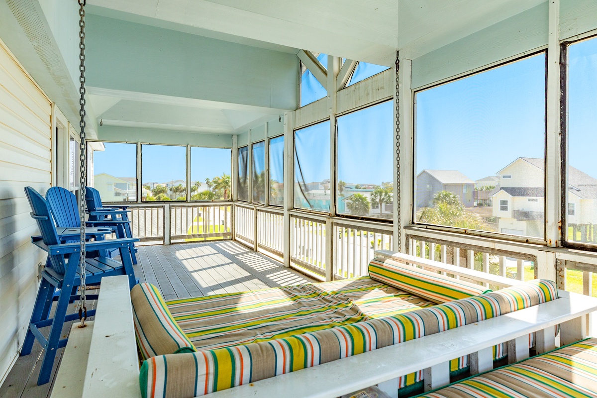 The upper level screened deck is the perfect spot to relax