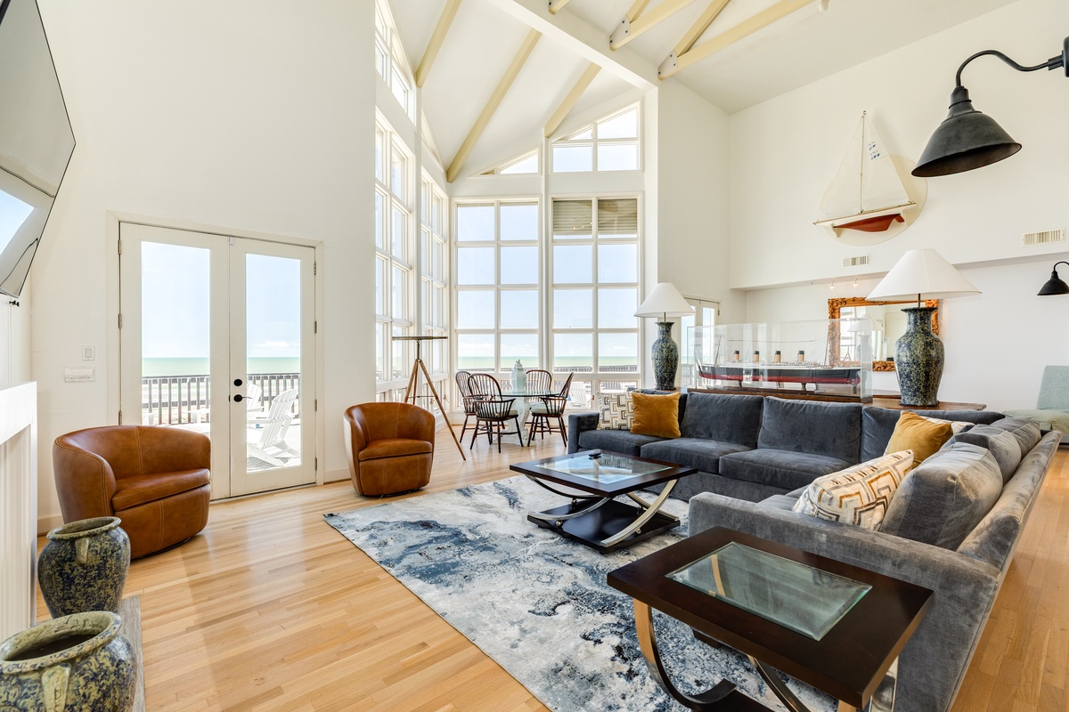 Open living area with vaulted ceilings and plenty of natural light