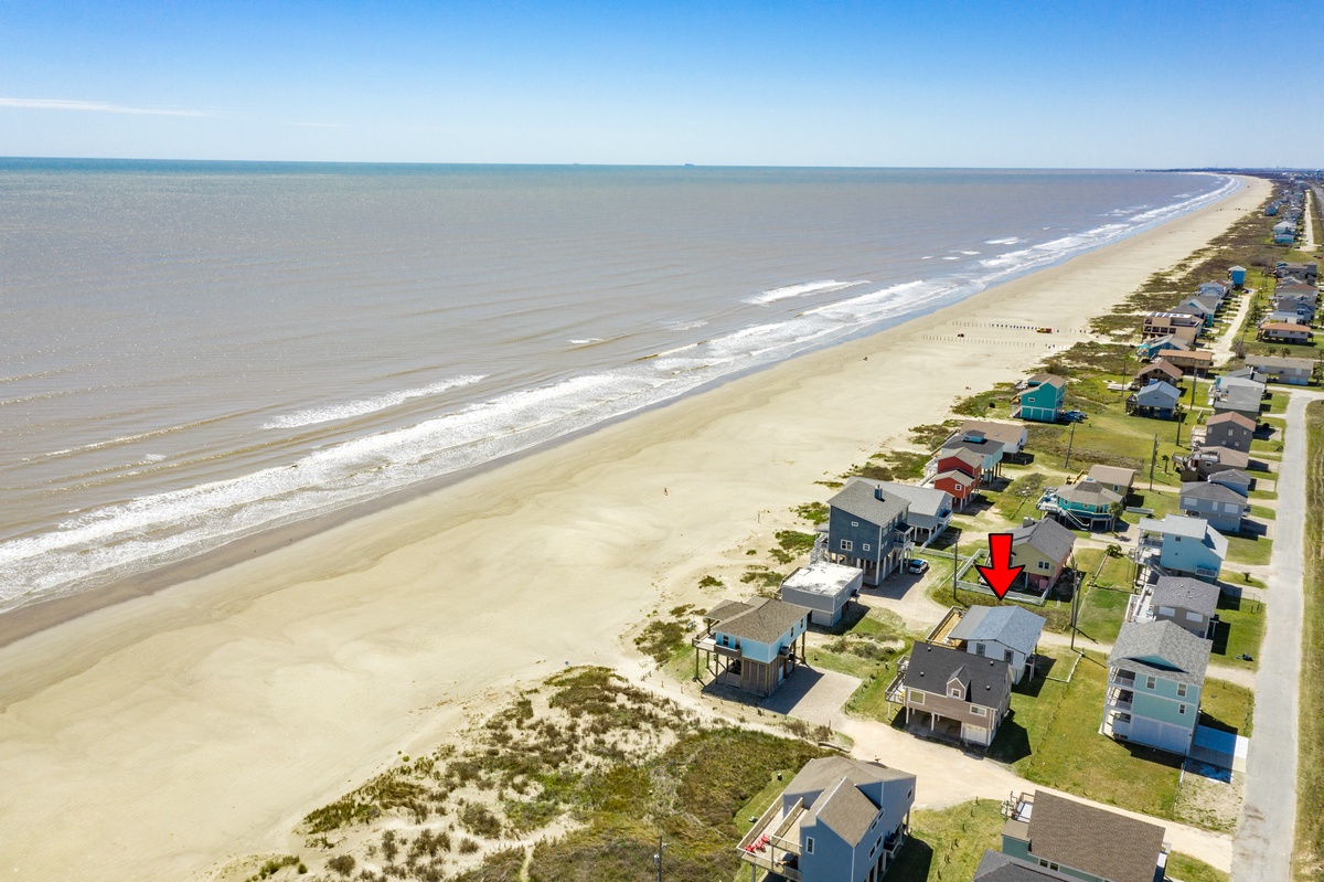 Sand & surf are only steps away at this 2nd row home