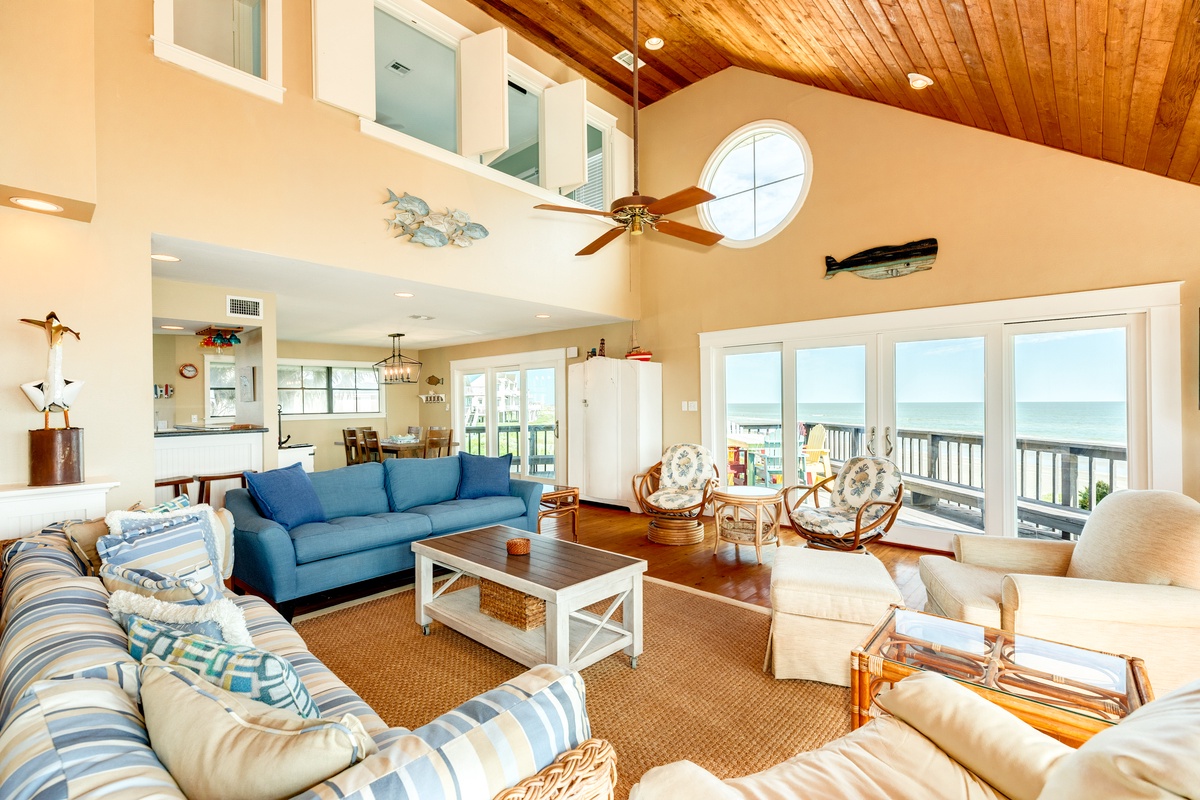 Warm and inviting living area with wall of windows