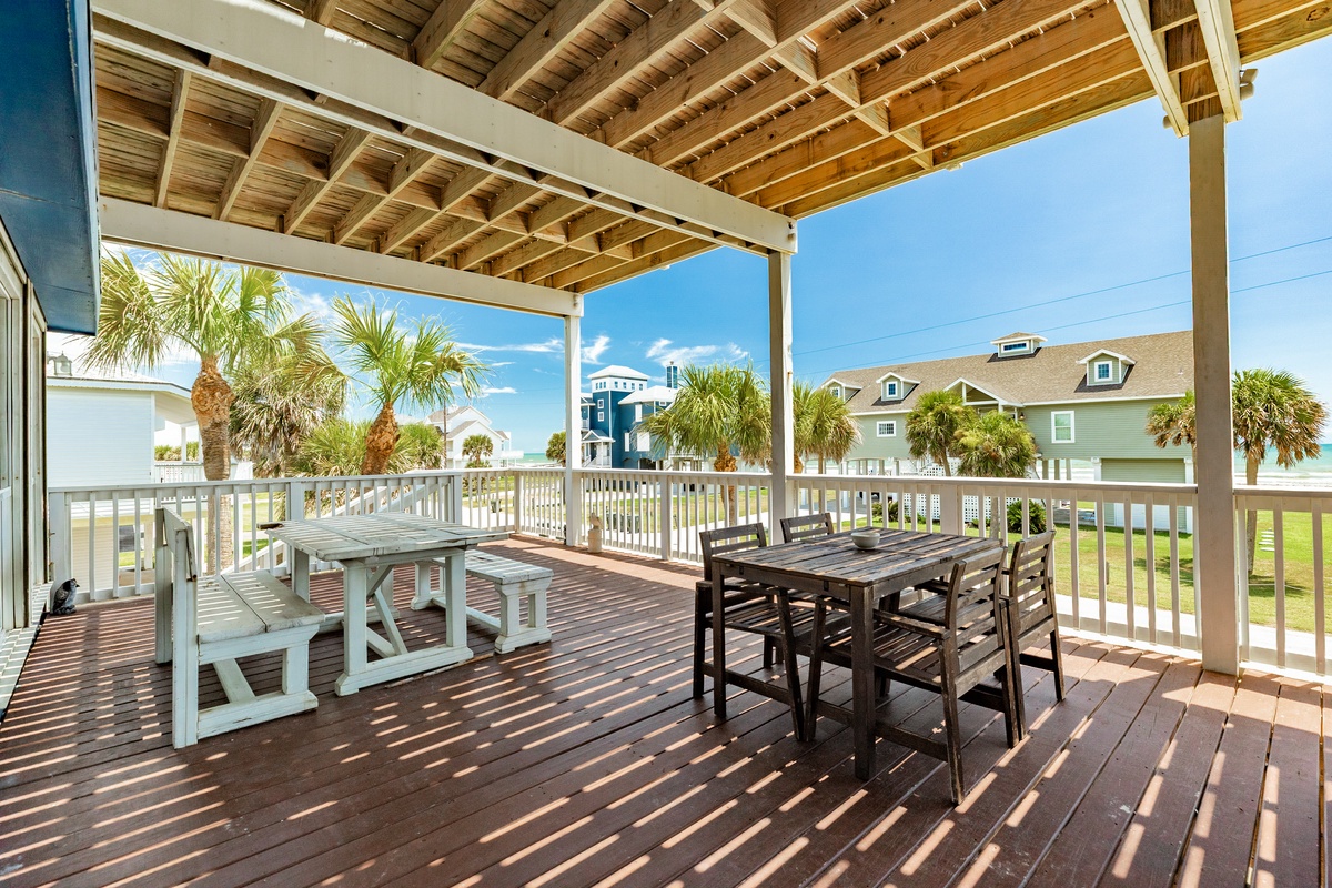Unwind after a day at the beach on the large covered deck