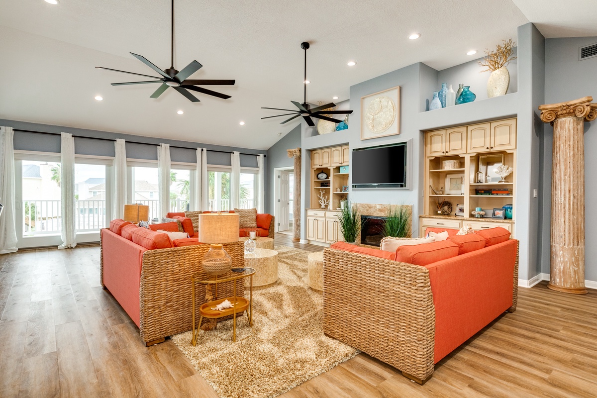 Wall of windows and vaulted ceilings brighten the room up