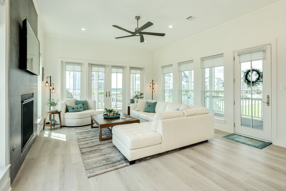 Bright and airy living area with walls of windows