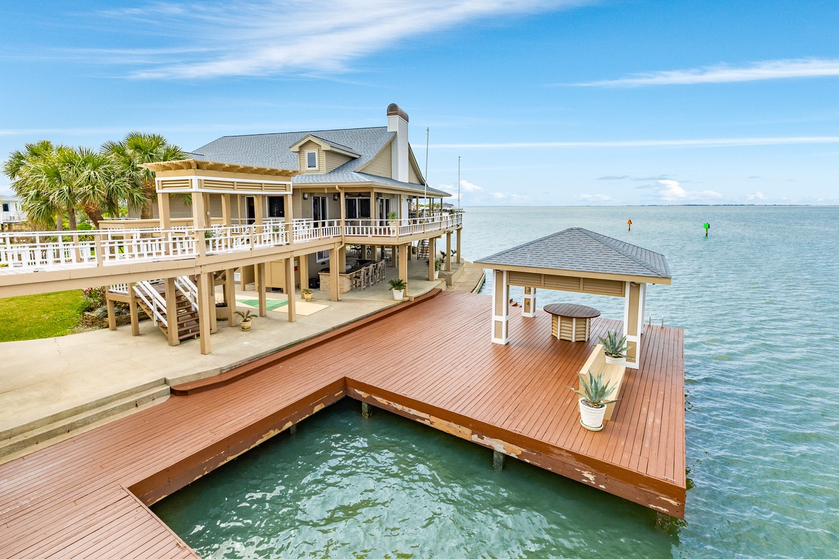 Main level deck walkway connects the main house to the guest house