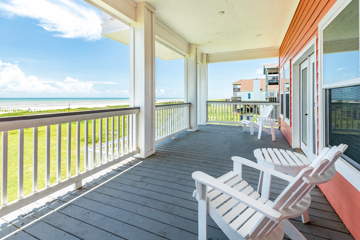 Enjoy panoramic beachfront views from the covered deck