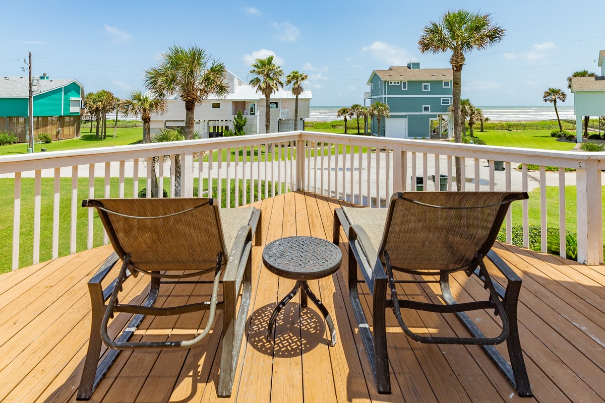 Enjoy peek-a-boo views of the Gulf from the deck