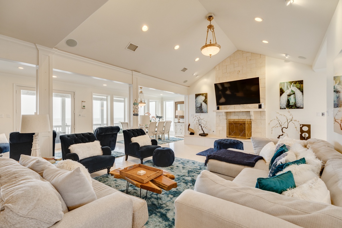 Bright & airy living room with wall of windows showcasing Gulf view