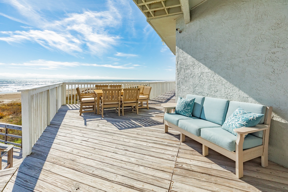 Unwind on your private deck with plush seating and dining space