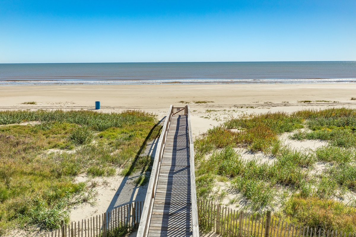 Head across the private walkover to the beach