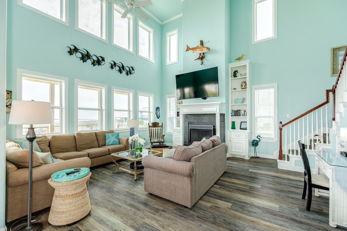 Wall of windows in the bright and airy living room