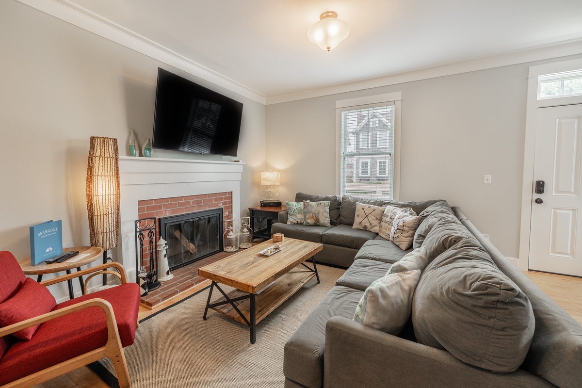 Cozy up on the couch while enjoying the wood burning fireplace