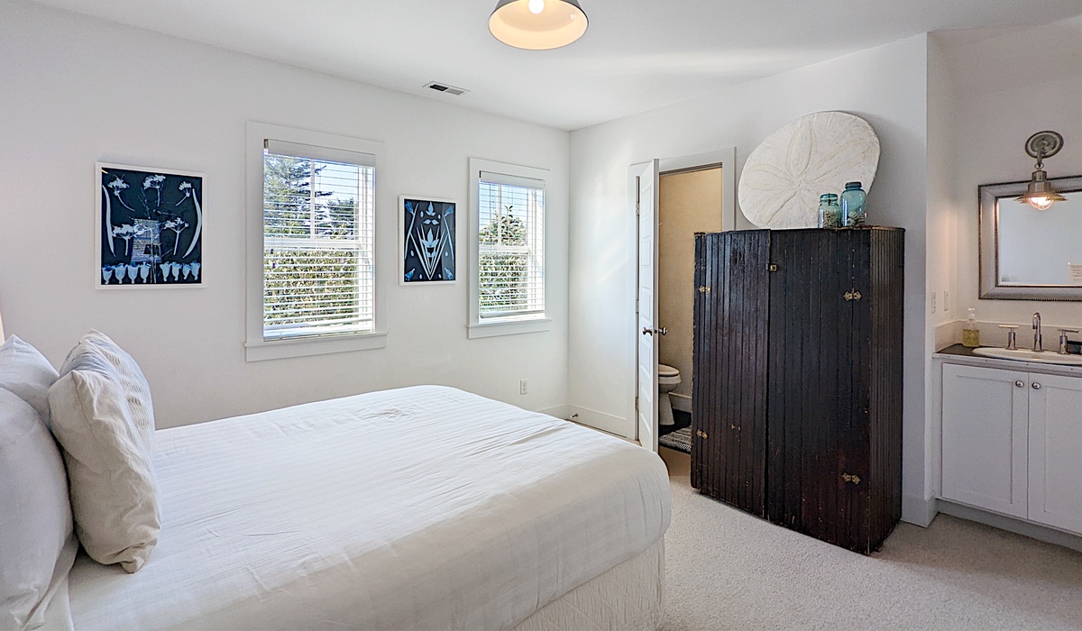 The bedroom has a sink and water closet