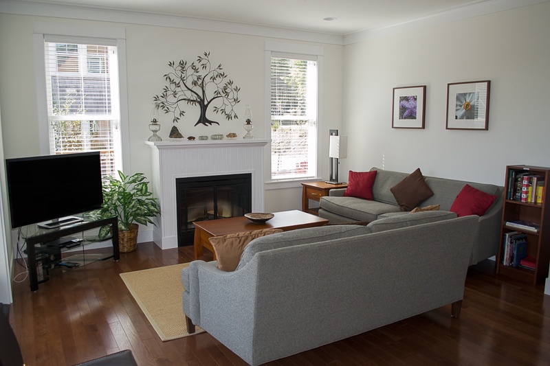 Living room with fireplace and large flat screen TV