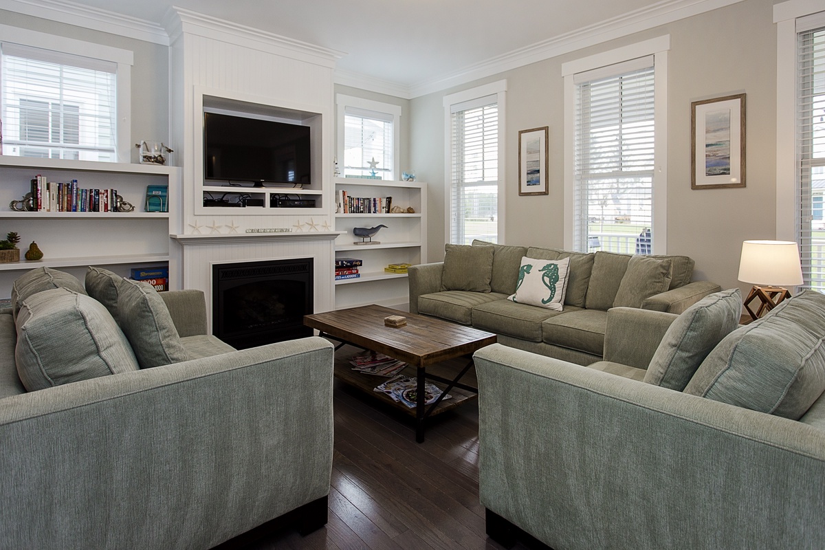 Living room with TV and fireplace