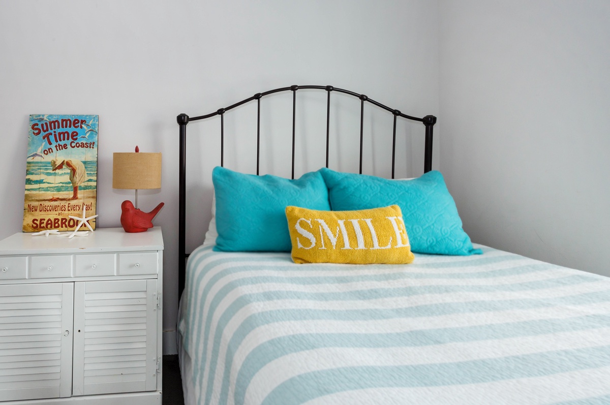 Queen bed and window with views facing East