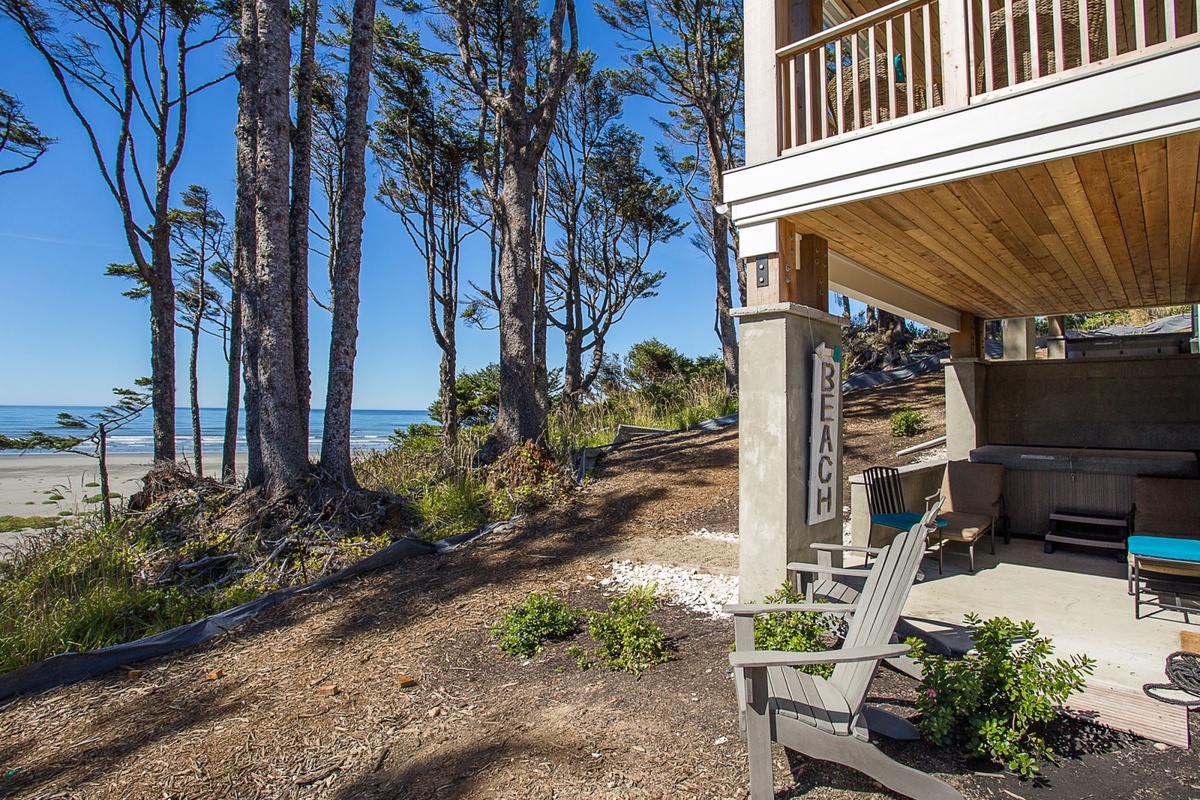 Back patio with hot tub and ocean view seating