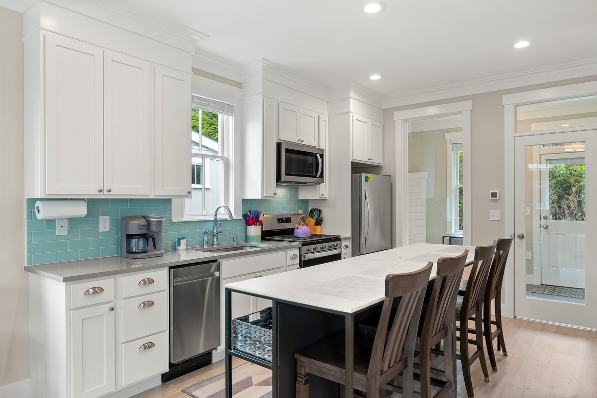 The large kitchen table doubles as an island