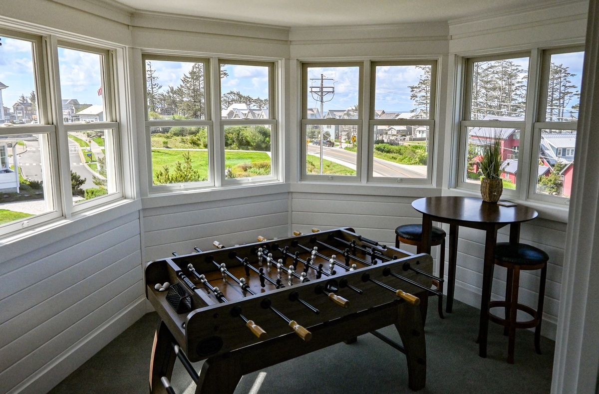 Foosball table and table with view of the ocean