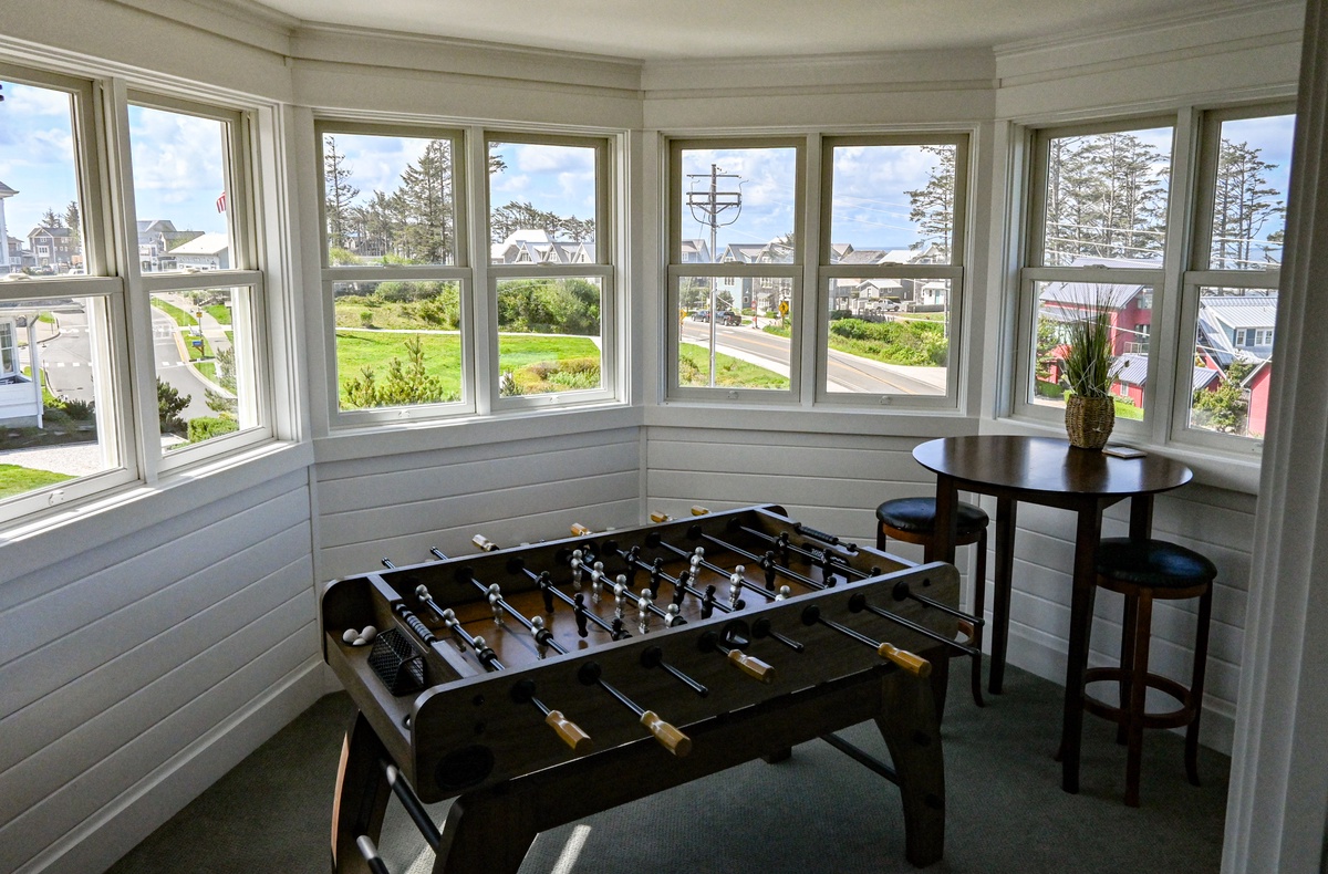 Play a game of Foosball table while enjoying a view of the ocean