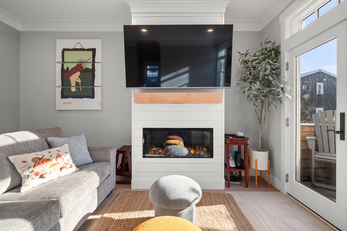 Cozy up by the warm glow of the fireplace