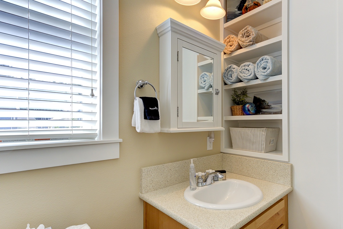 The ensuite bathroom has built-in storage