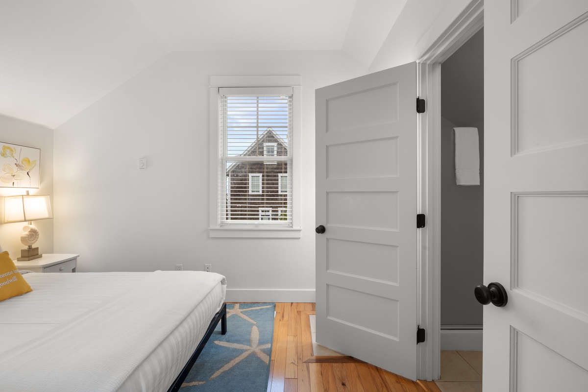 The carriage house bedroom offers comfort and tranquility for a restful stay