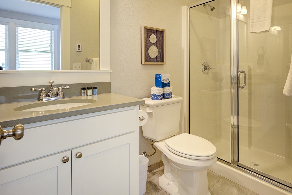 The ensuite bath has a walk-in shower