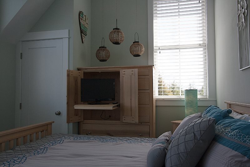 primary bedroom with TV