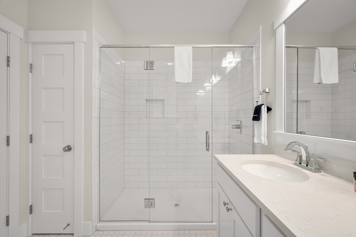 walk-in shower in primary ensuite bathroom