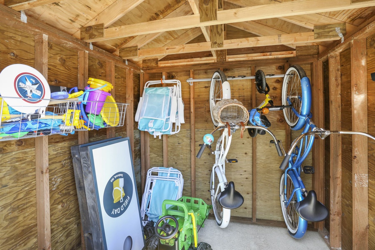 Shed with bikes, beach toys, chairs, and more