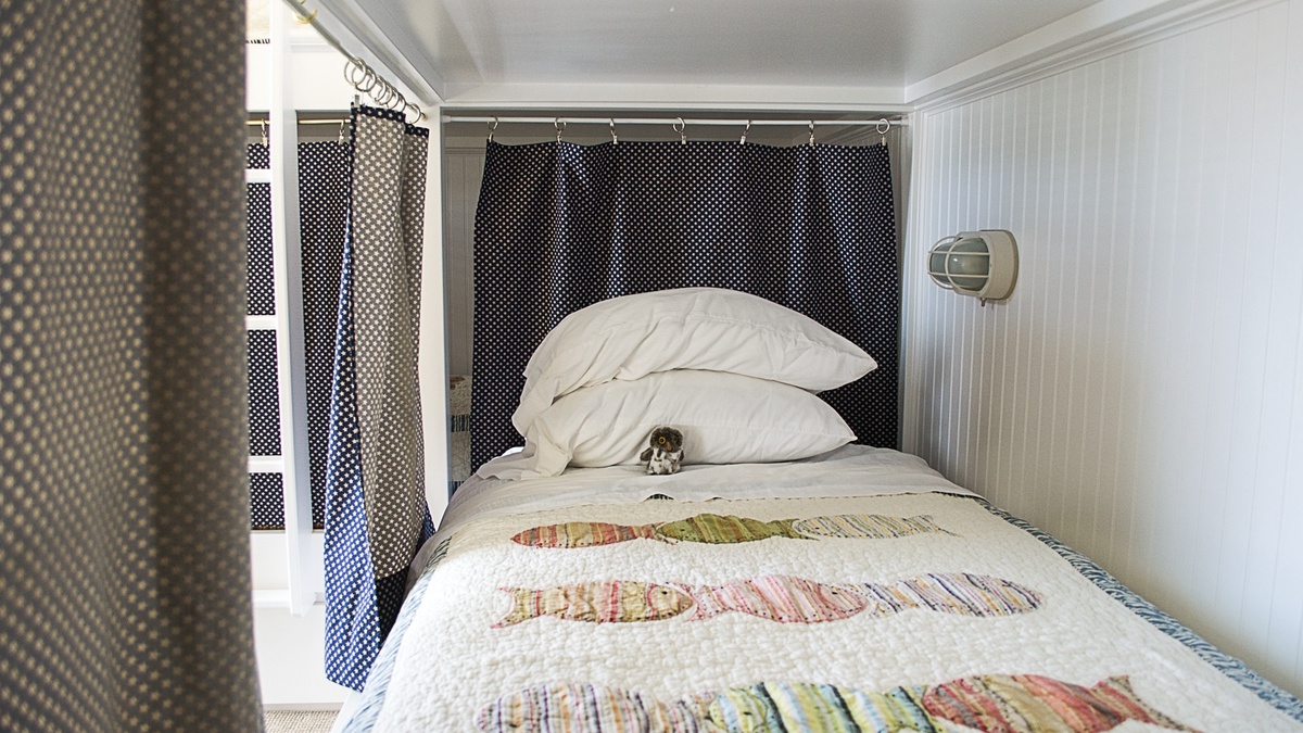 Each bunk bed has its own reading light and curtains