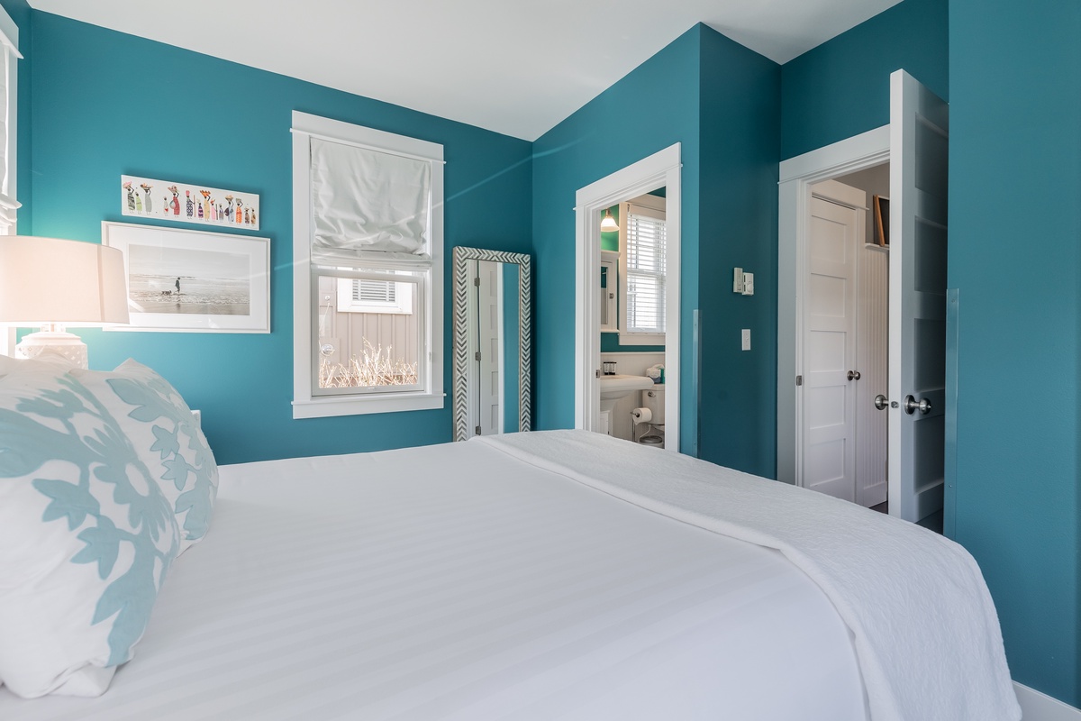 A stylish bedroom with a private ensuite for a restful and refreshing stay