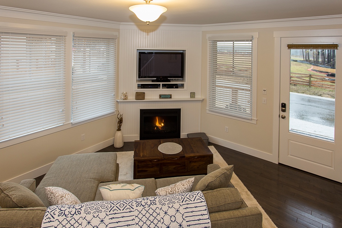 Living room with gas fireplace and tv