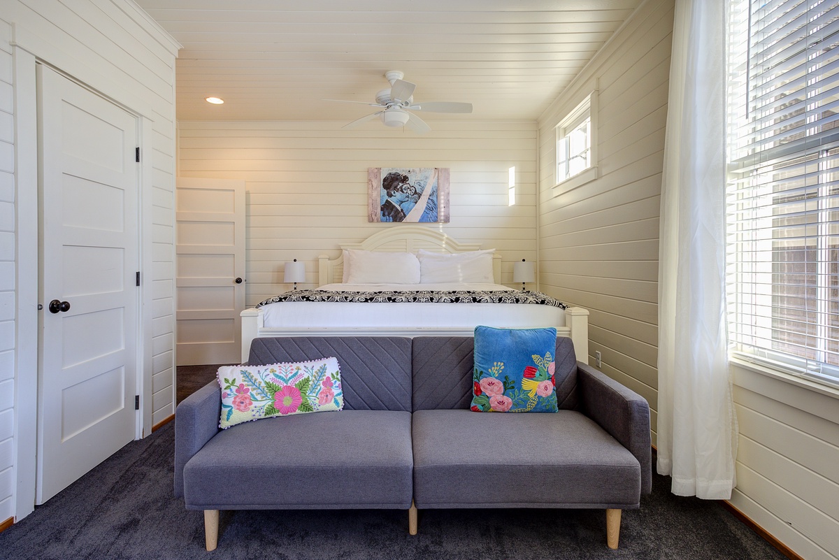 primary bedroom with balcony and ensuite bathroom