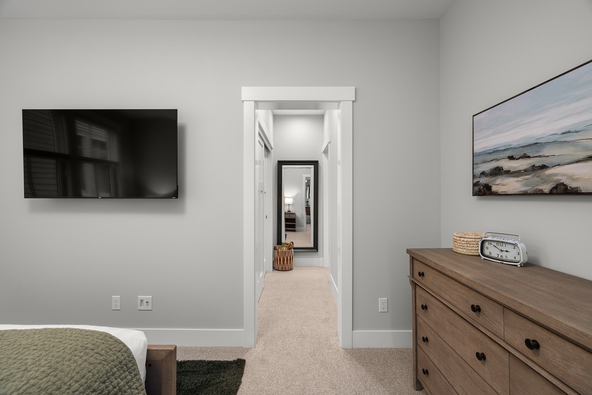 A large ensuite bathroom awaits down the hall