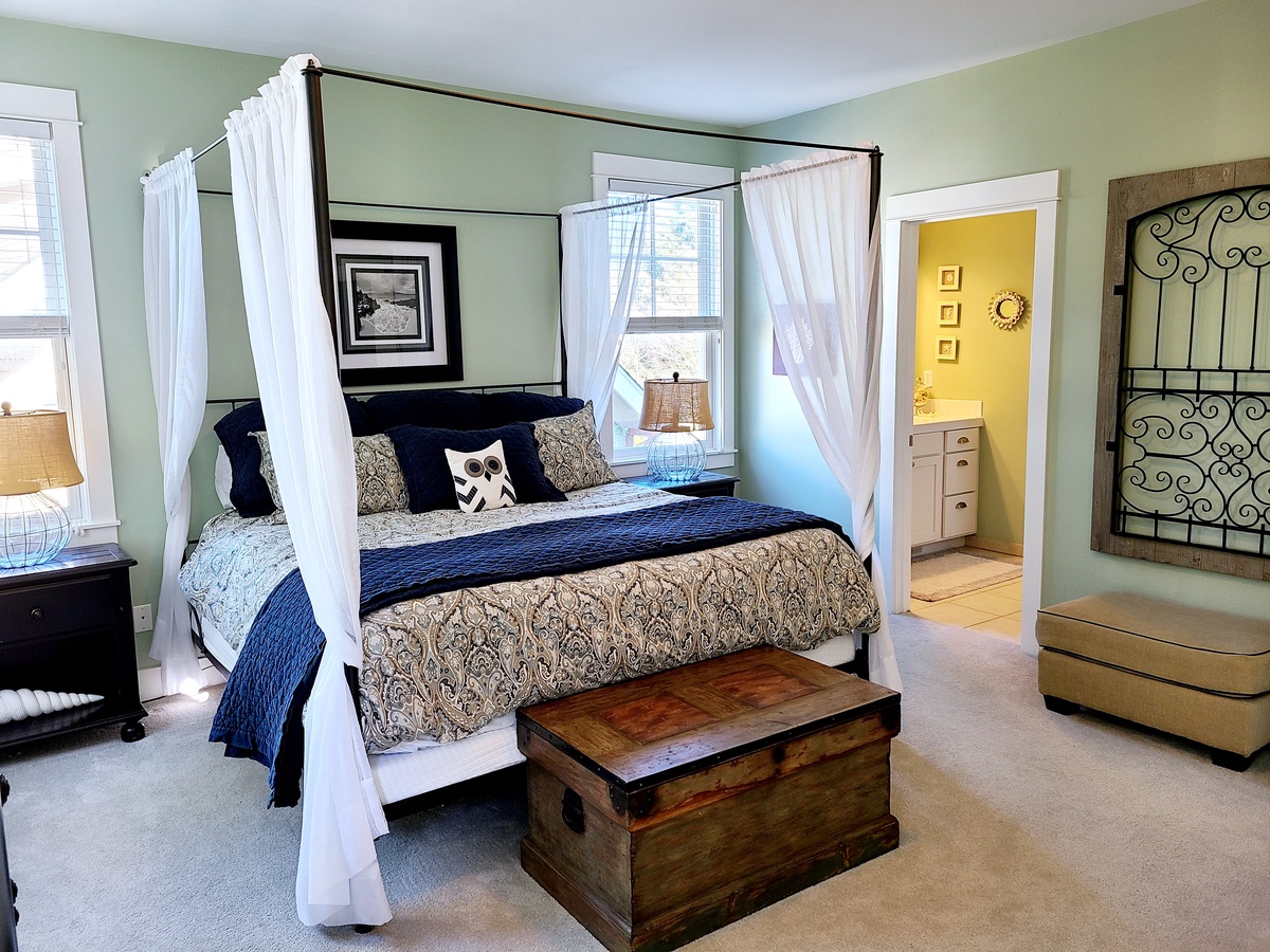 Large master bedroom suite with adjoining master bath featuring a large soaking tub, shower and walk-in closet